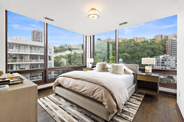 a bed room with a bed and a window