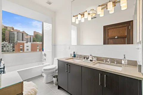 a bathroom with a toilet a sink and a bathtub