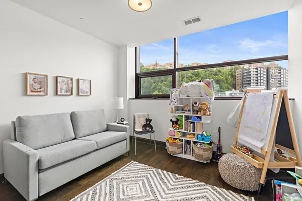 a living room with furniture and a window