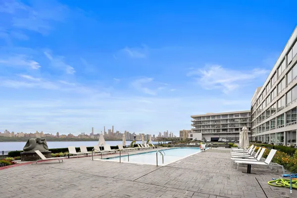 a view of a swimming pool with a chairs