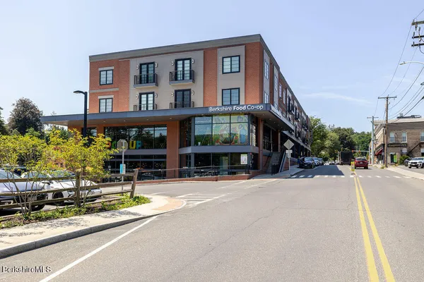 a front view of a building with street view