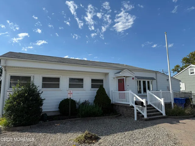 a house view with a sitting space and garden space