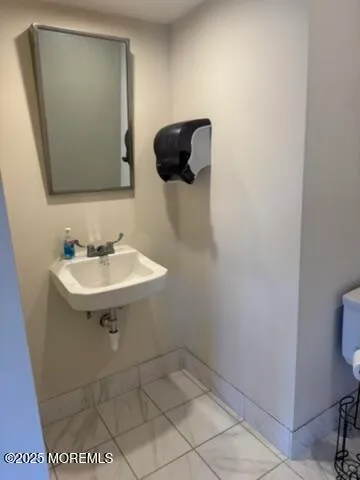 a bathroom with a sink and mirror