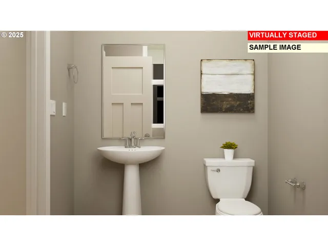 a bathroom with a sink mirror and toilet