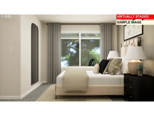 a bedroom with a bed and large mirror