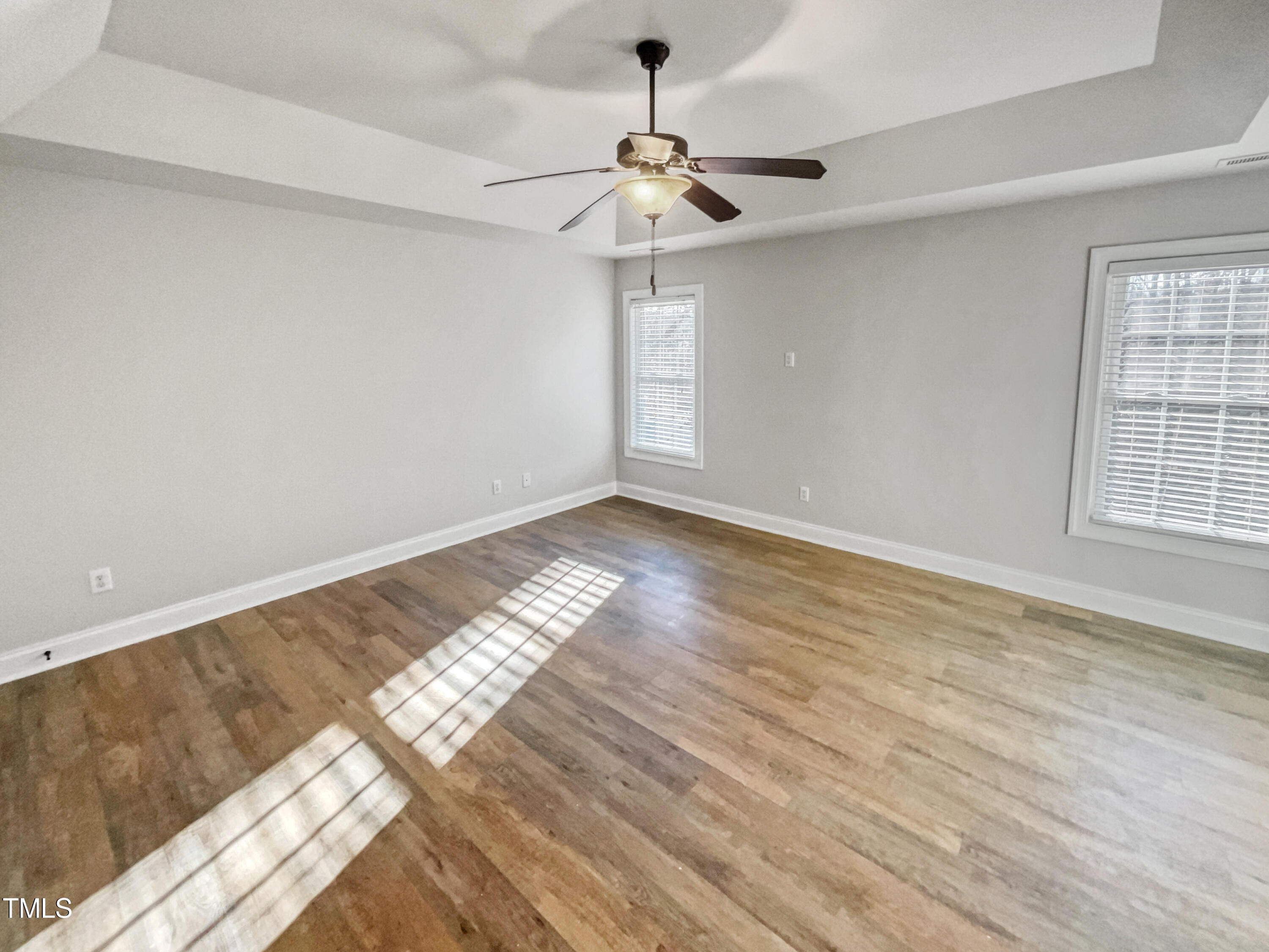 421 Cottesbrook Drive Wake Forest, NC 27587 - Photo 5 of 19 a view of empty room with wooden floor and fan