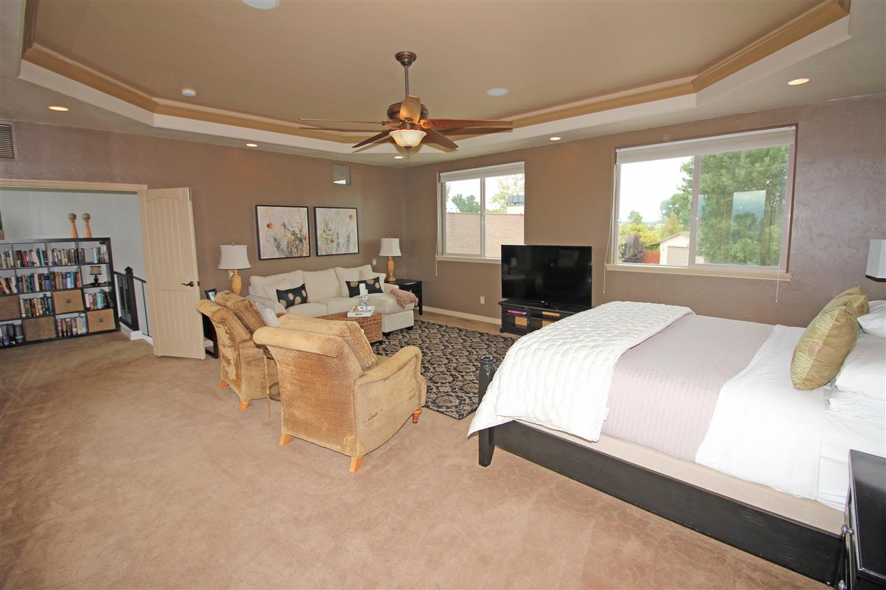 1116 22 Road Grand Junction, CO 81505 - Photo 21 of 42 a bed room with a bed mirror and a window