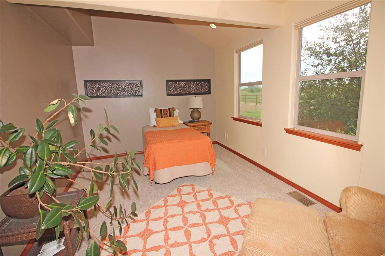 1116 22 Road Grand Junction, CO 81505 - Photo 30 of 42 a bedroom with a bed and window