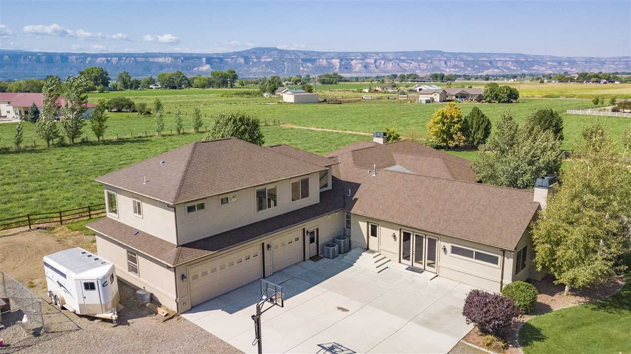 1116 22 Road Grand Junction, CO 81505 - Photo 36 of 42 an aerial view of a house with big yard and large tree