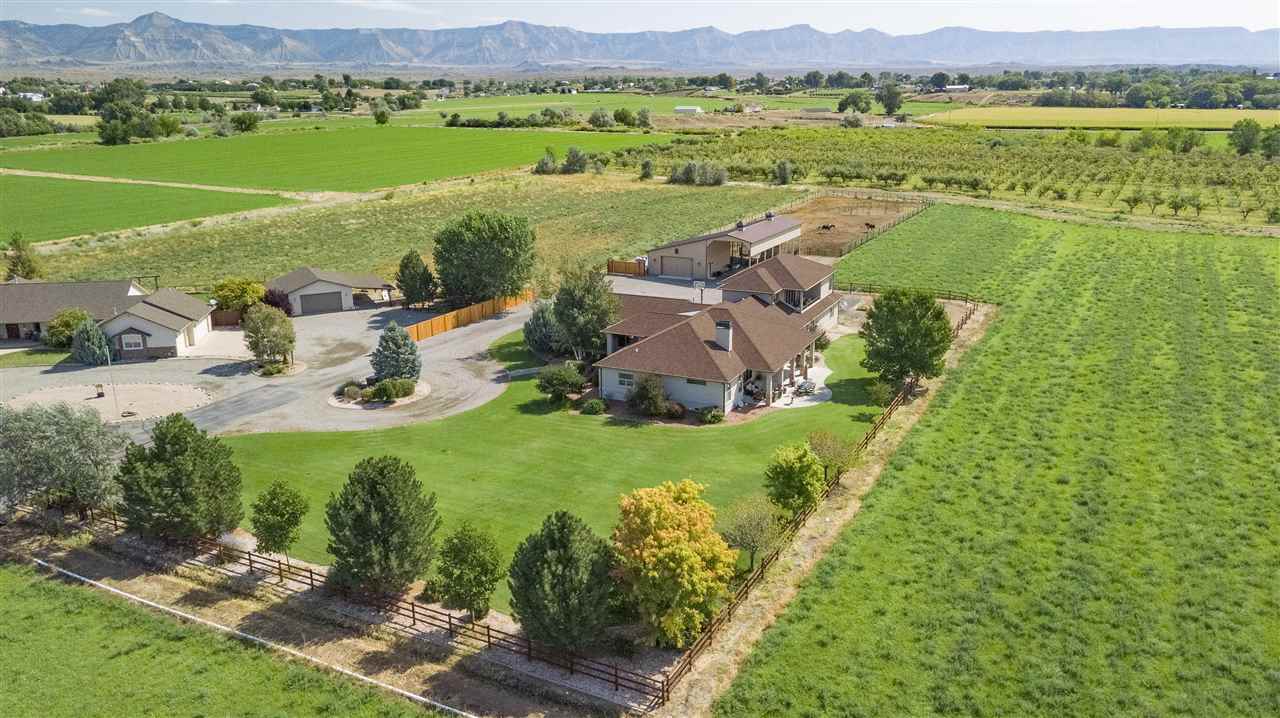 1116 22 Road Grand Junction, CO 81505 - Photo 41 of 42 an aerial view of residential houses with outdoor space and river