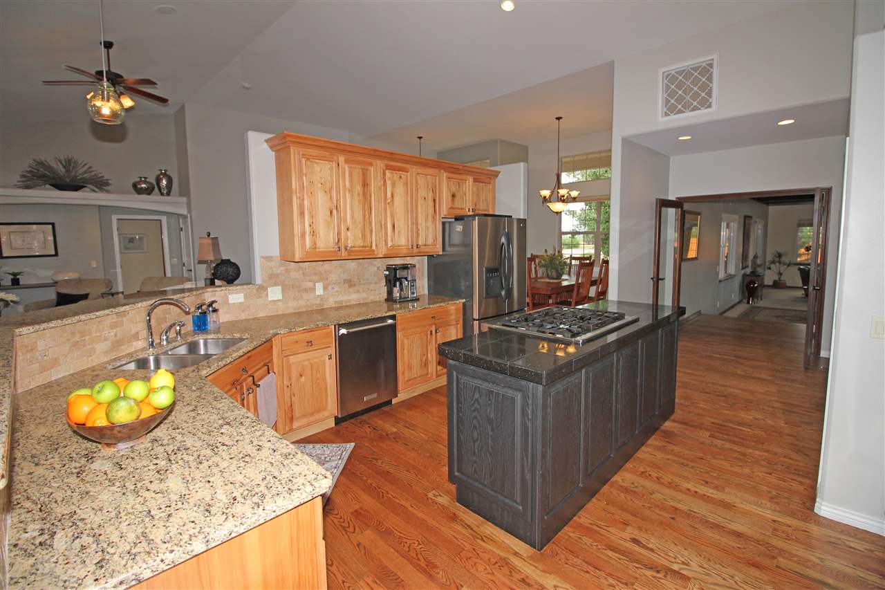 1116 22 Road Grand Junction, CO 81505 - Photo 8 of 42 a kitchen with wooden cabinets and sink