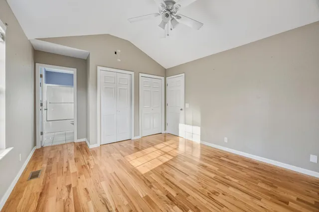 a view of a livingroom with wooden floor and closet area