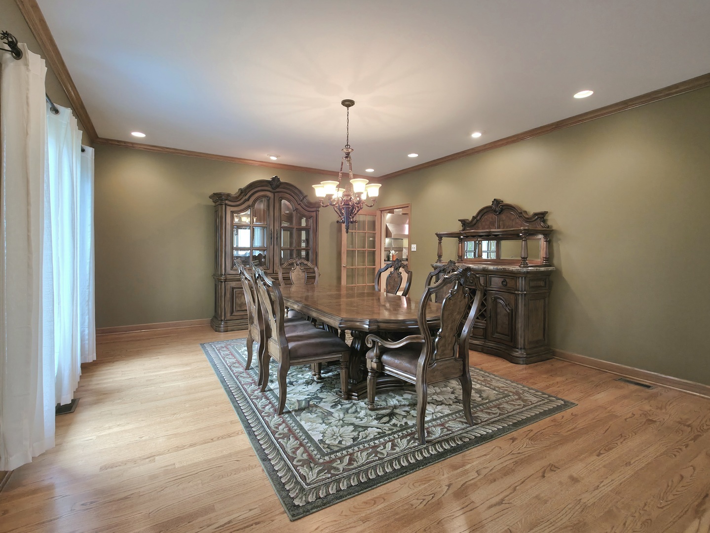 10160 Lancaster Drive Mokena, IL 60448 - Photo 14 of 41 a view of a dining room with furniture and chandelier