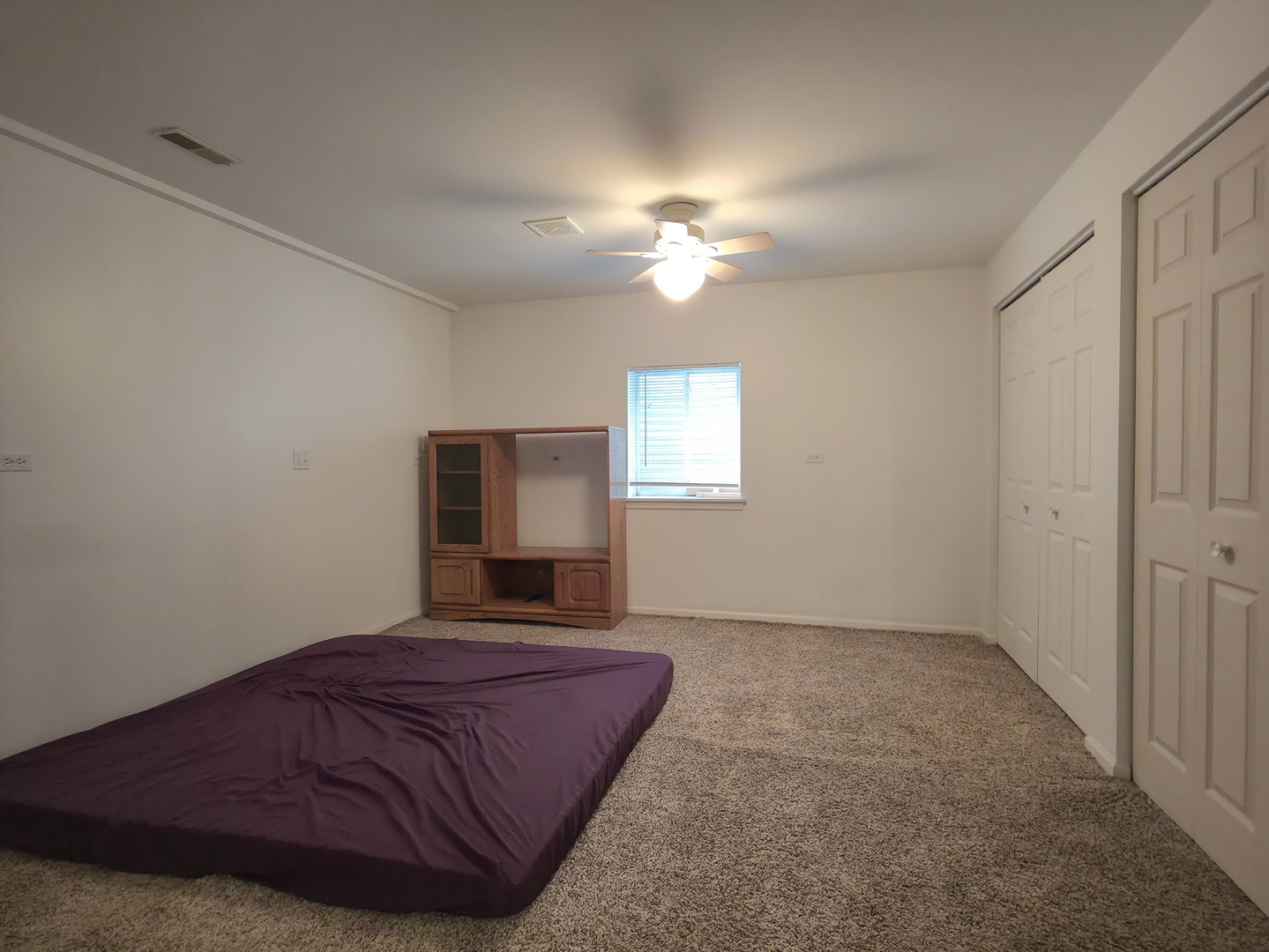 10160 Lancaster Drive Mokena, IL 60448 - Photo 23 of 41 a spacious bedroom with a bed and a chandelier