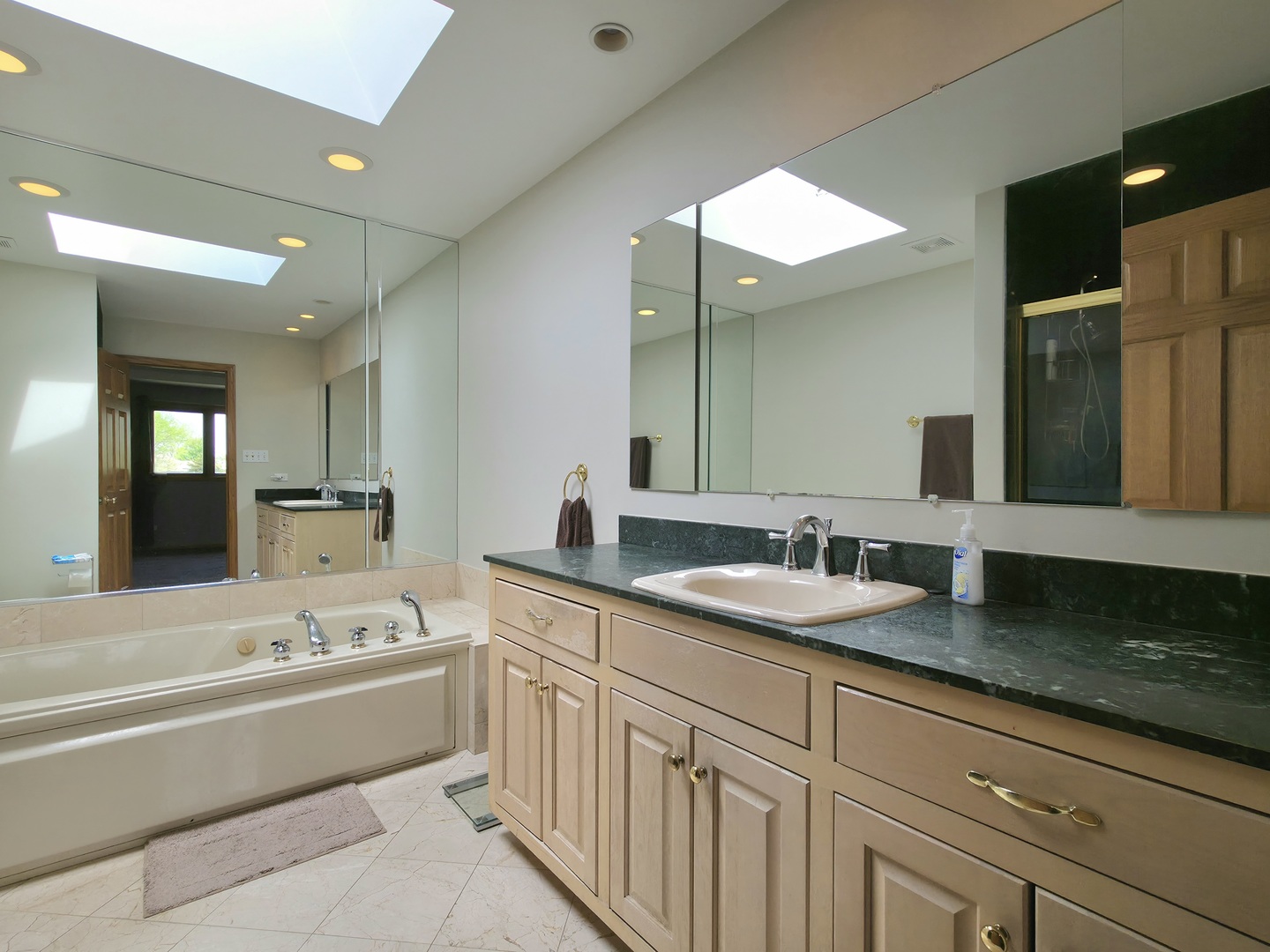 10160 Lancaster Drive Mokena, IL 60448 - Photo 27 of 41 a bathroom with a granite countertop sink mirror and bathtub