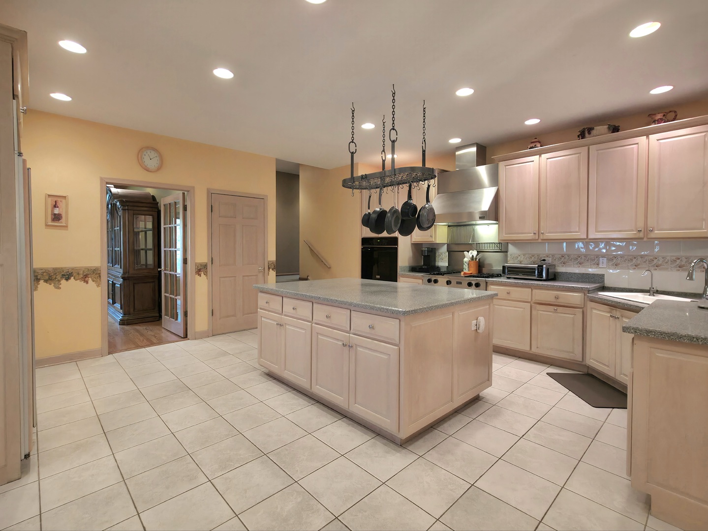 10160 Lancaster Drive Mokena, IL 60448 - Photo 4 of 41 a kitchen with stainless steel appliances kitchen island granite countertop a refrigerator and a sink