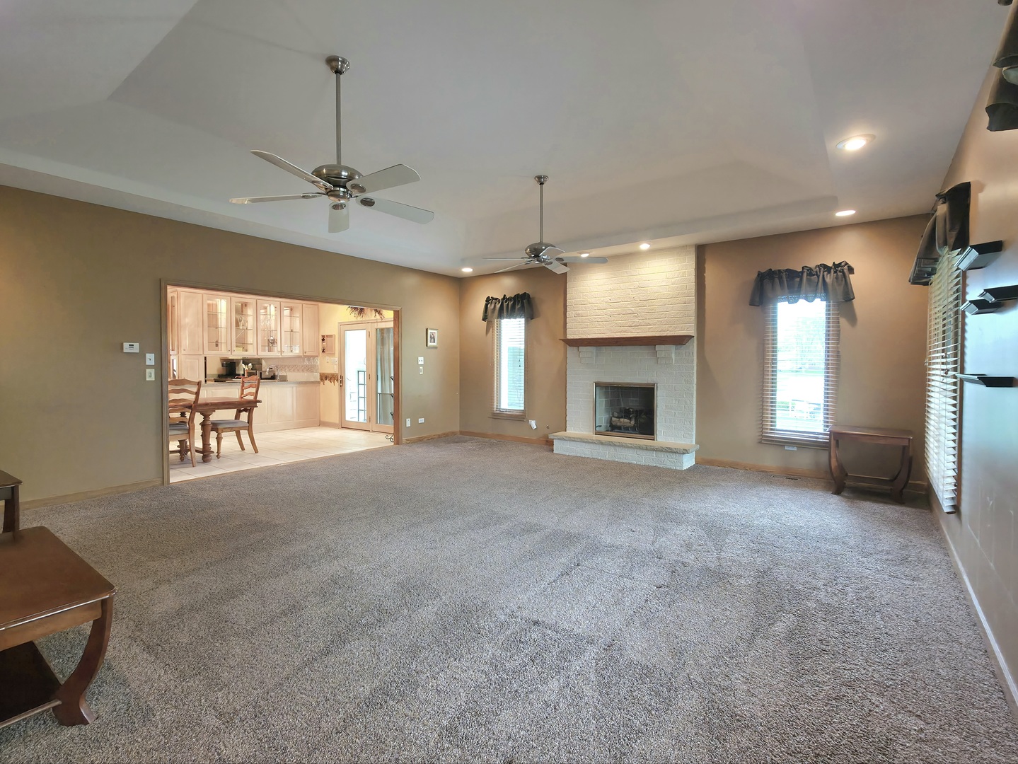 10160 Lancaster Drive Mokena, IL 60448 - Photo 10 of 41 a view of an empty room with a fireplace and a window