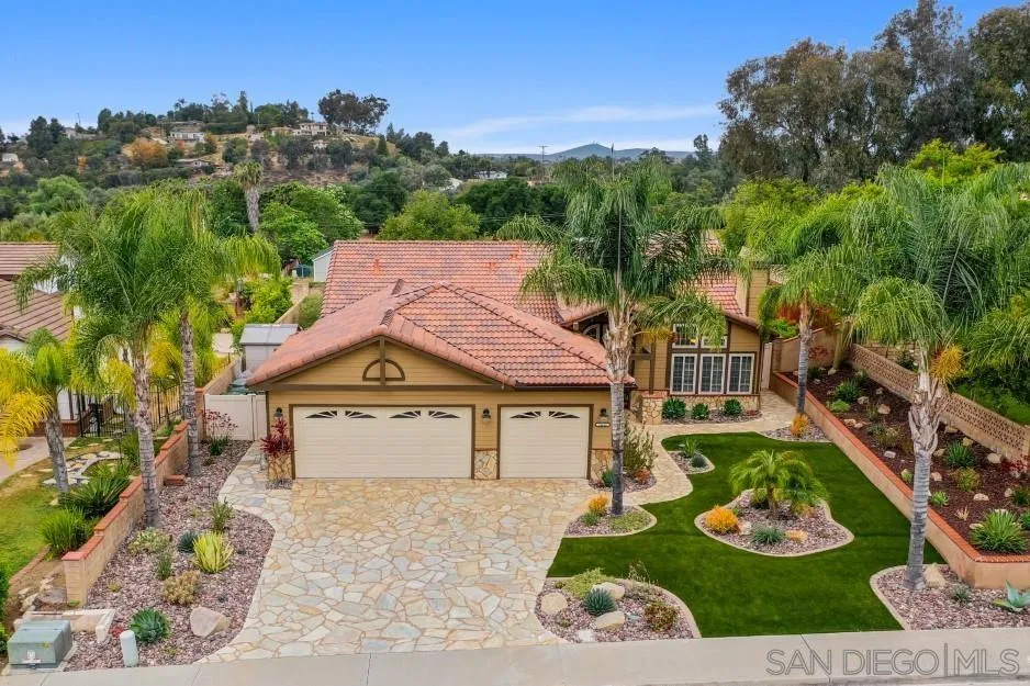 14420 Silver Heights Road Poway, CA 92064 - Photo 1 of 73 a front view of a house with a garden and plants