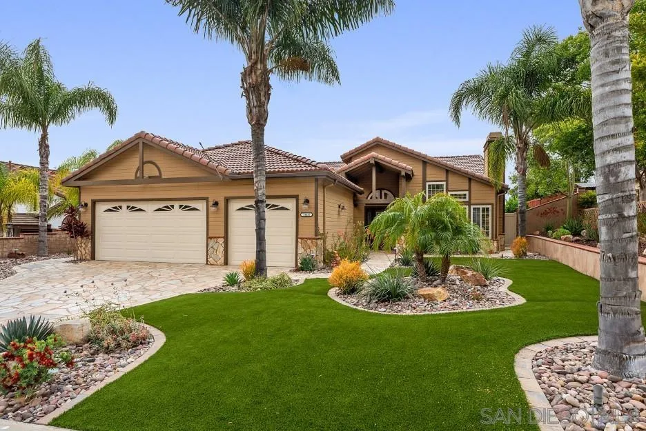 14420 Silver Heights Road Poway, CA 92064 - Photo 17 of 73 a front view of a house with a garden and yard