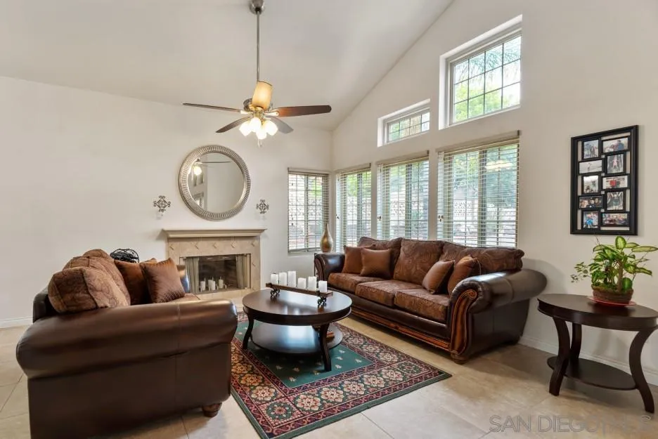 14420 Silver Heights Road Poway, CA 92064 - Photo 24 of 73 a living room with furniture a fireplace and a large window