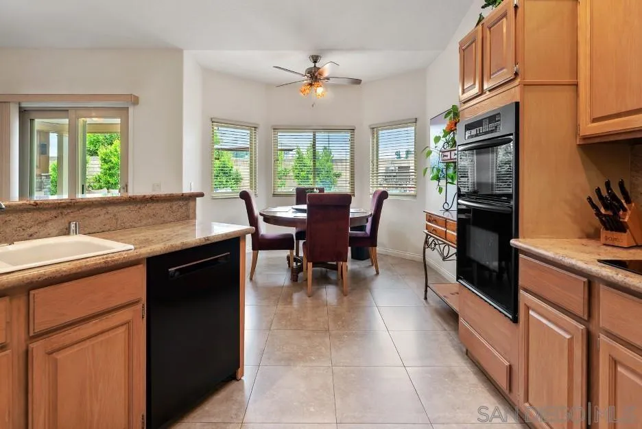 14420 Silver Heights Road Poway, CA 92064 - Photo 37 of 73 a large white kitchen with granite countertop lots of counter top space