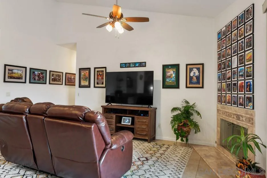 14420 Silver Heights Road Poway, CA 92064 - Photo 39 of 73 a living room with furniture and a flat screen tv
