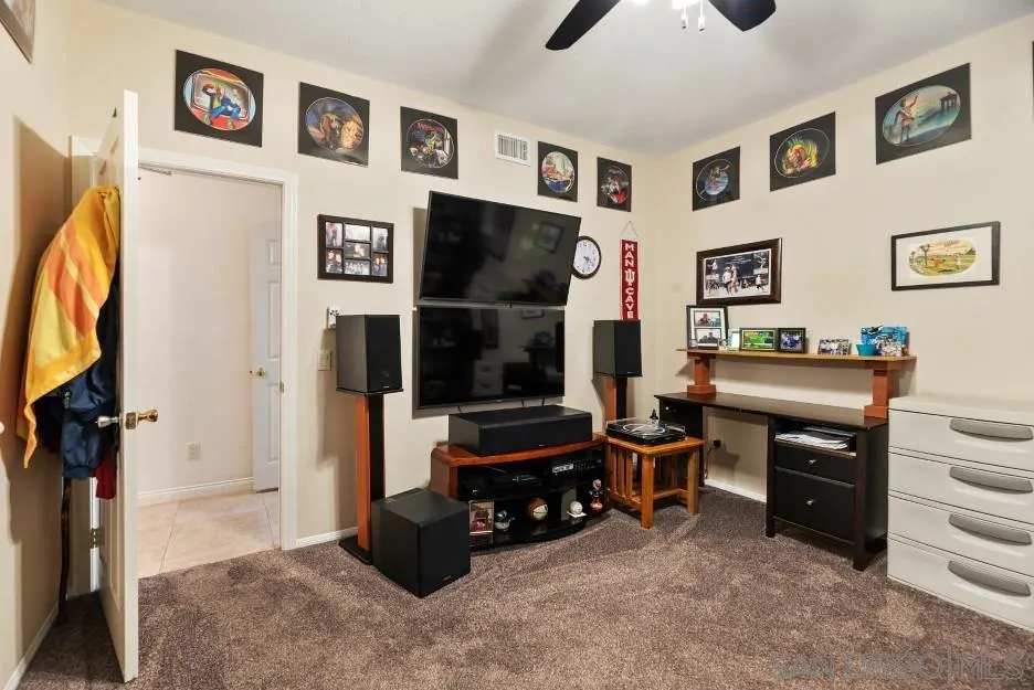 14420 Silver Heights Road Poway, CA 92064 - Photo 55 of 73 a room with furniture and a flat screen tv