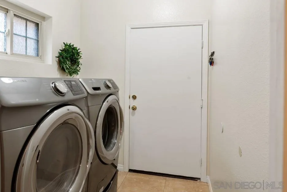 14420 Silver Heights Road Poway, CA 92064 - Photo 57 of 73 a utility room with dryer and washer