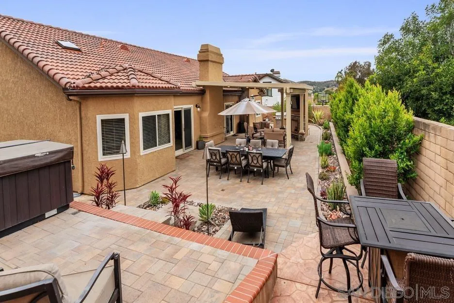 14420 Silver Heights Road Poway, CA 92064 - Photo 72 of 73 a view of a patio with table and chairs and potted plants