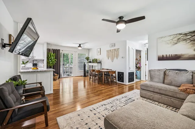 a bathroom with a granite countertop sink vanity and mirror