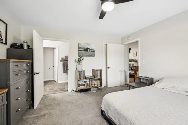 a bedroom with furniture and a window