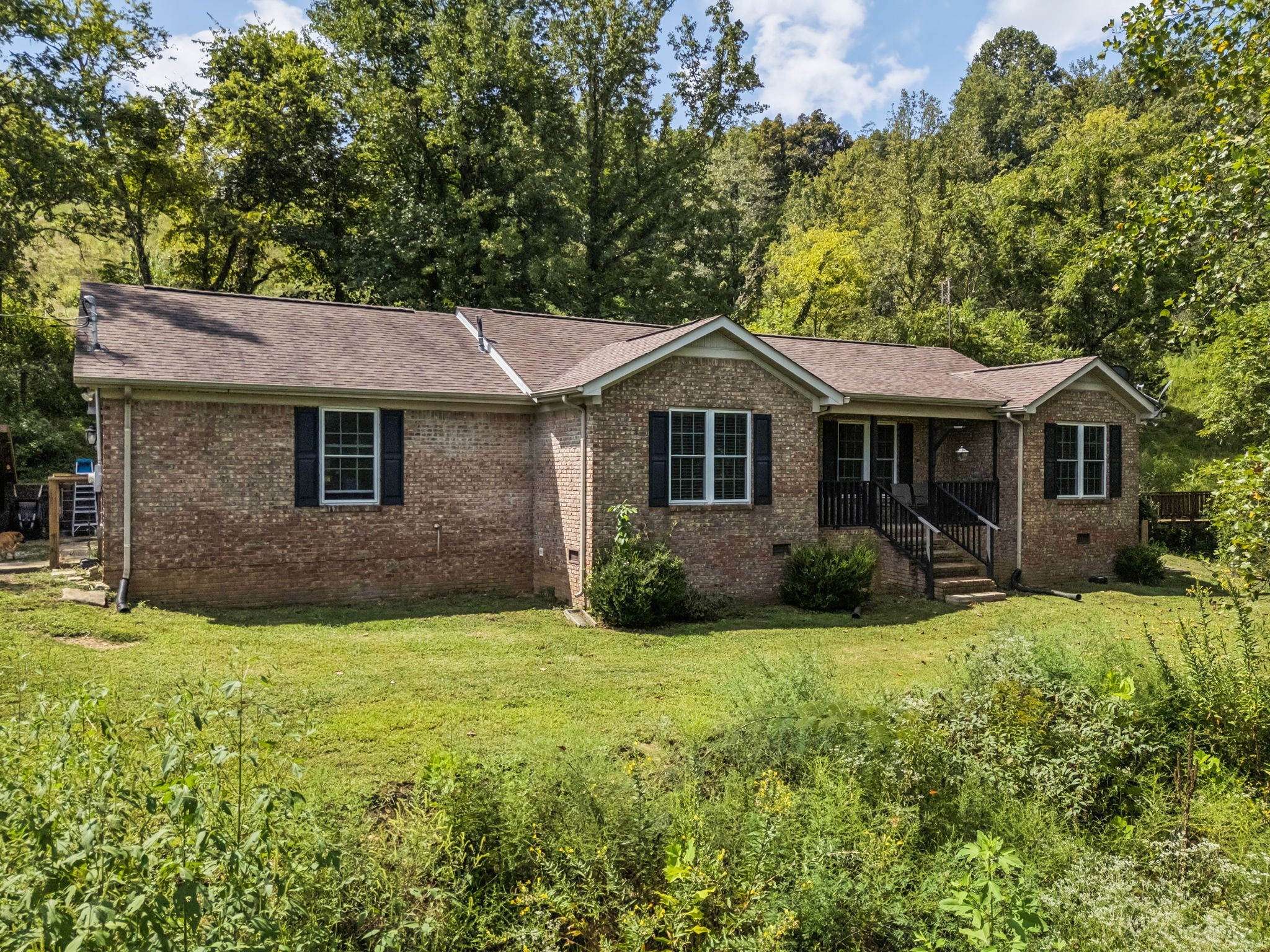 4951 Weakley Creek Road Lawrenceburg, TN 38464 - Photo 2 of 75 a front view of a house with yard and green space
