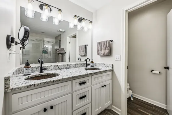 a living room with furniture a flat screen tv and a window