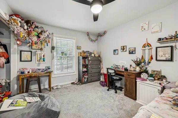 an aerial view of a house with yard swimming pool and outdoor seating