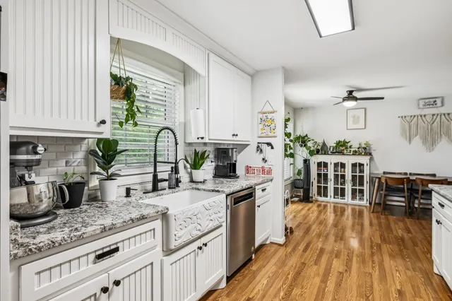a kitchen with wooden cabinets and a stove top oven