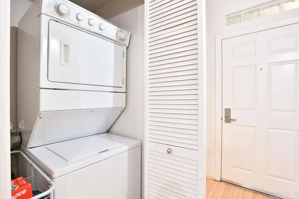 a bedroom with a bed and a chair