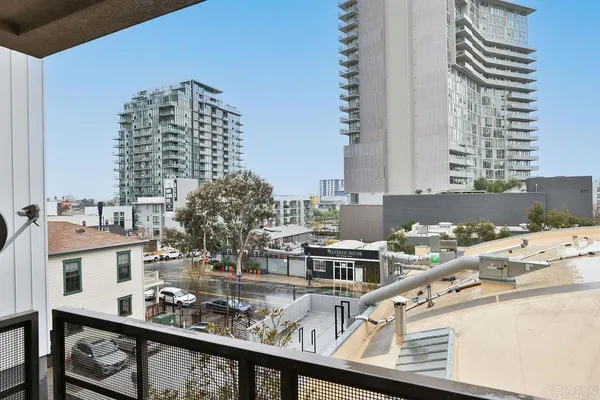 a view of a chairs and tables back yard of the building
