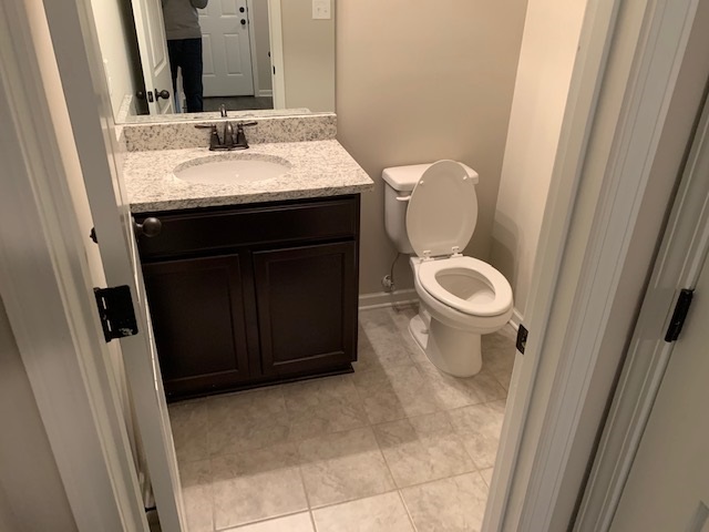 1065 Carib Loop East Cordova, TN 38018 - Photo 14 of 16 a bathroom with a sink and a toilet