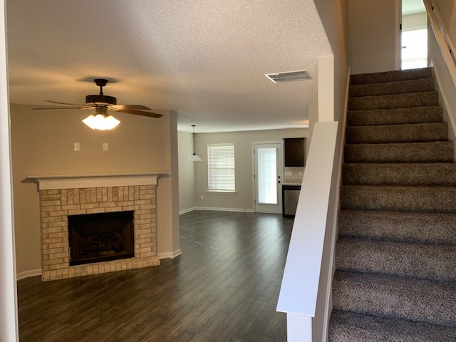 1065 Carib Loop East Cordova, TN 38018 - Photo 5 of 16 a view of an empty room with wooden floor fireplace and a window