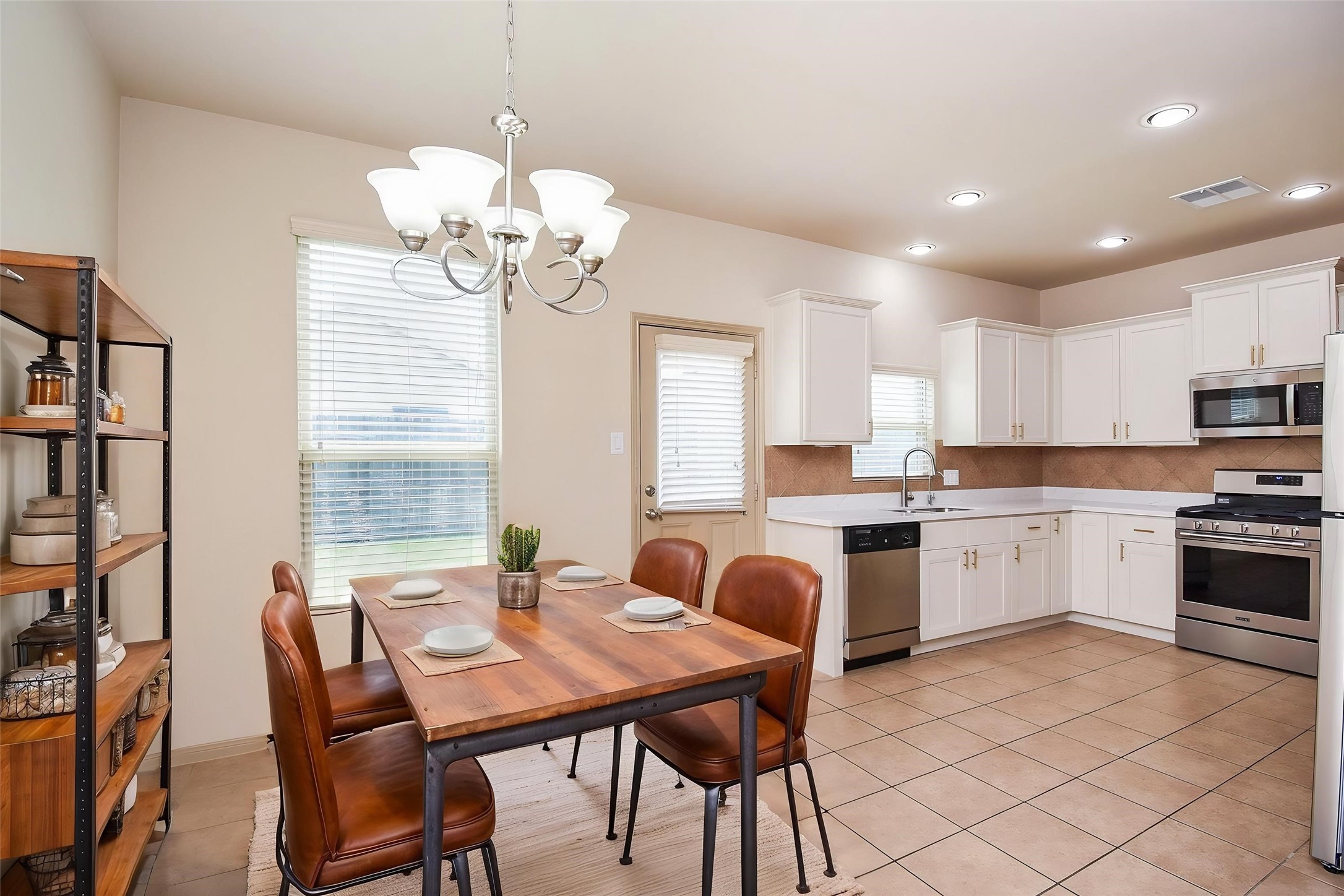 2106 Harmon Crest Court Spring, TX 77373 - Photo 10 of 37 a open dining room with stainless steel appliances kitchen island granite countertop furniture and a kitchen view