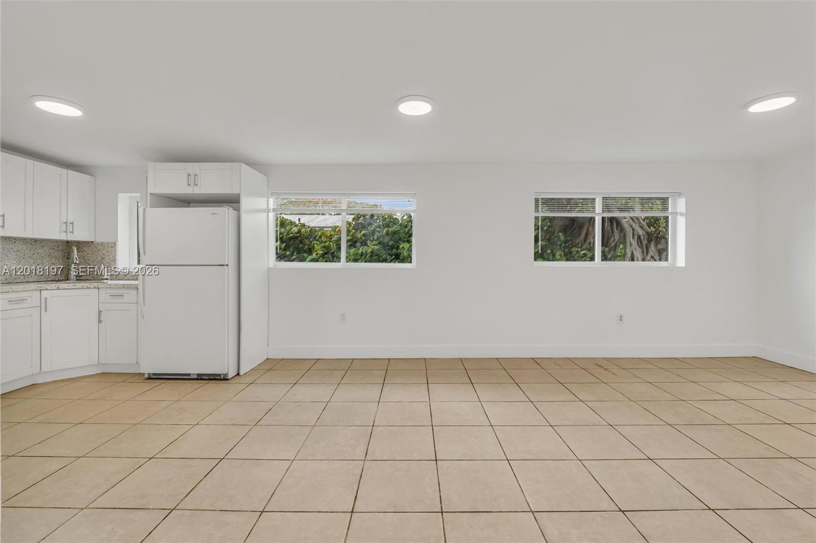 628 Southwest 8th Avenue Homestead, FL 33030 - Photo 9 of 25 a view of a kitchen space with white cabinets