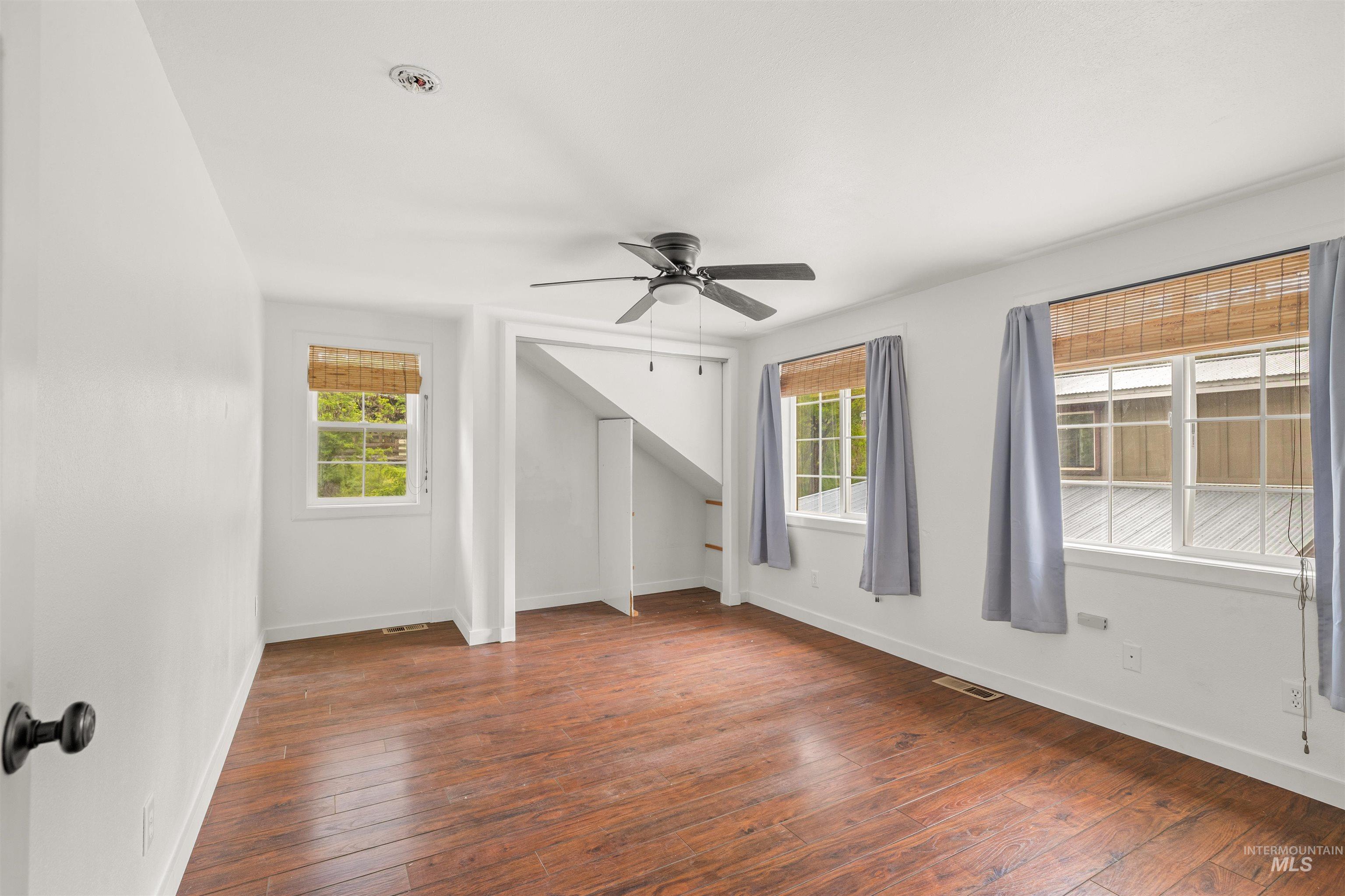 1314 Cedar Ridge Road Kendrick, ID 83537 - Photo 31 of 50 Bright room featuring wood-finish flooring and white walls
