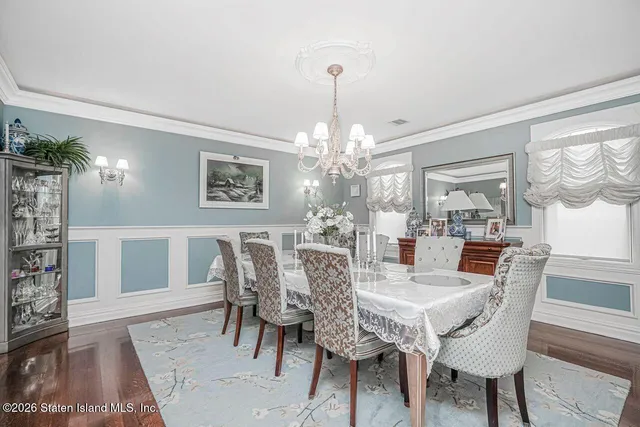 a kitchen with appliances cabinets and chair
