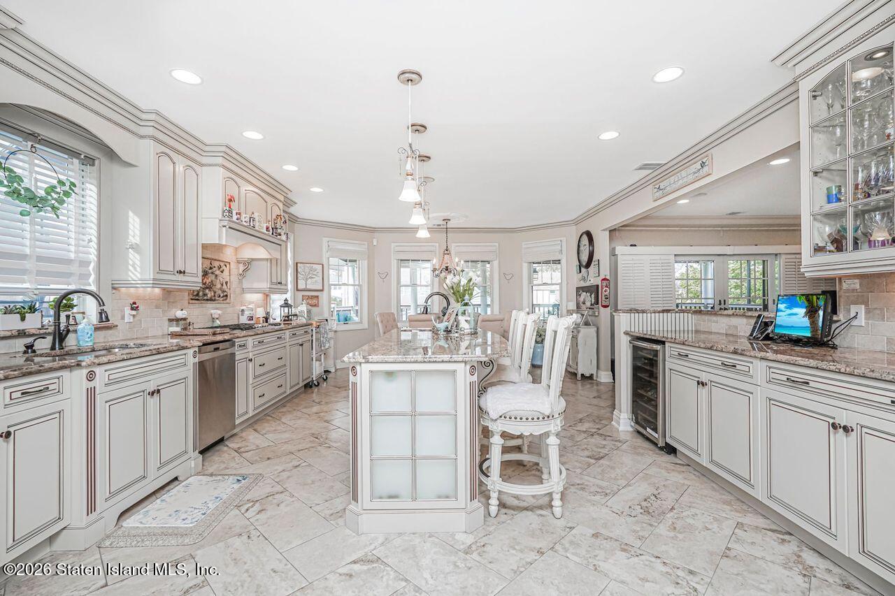 63 Finlay Avenue Staten Island, NY 10309 - Photo 13 of 44 a kitchen with appliances cabinets and chair