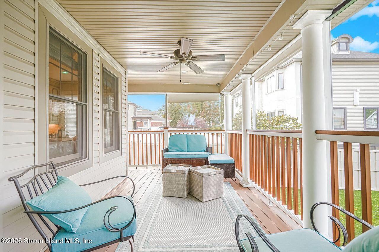 63 Finlay Avenue Staten Island, NY 10309 - Photo 25 of 44 a living room with furniture and a large window