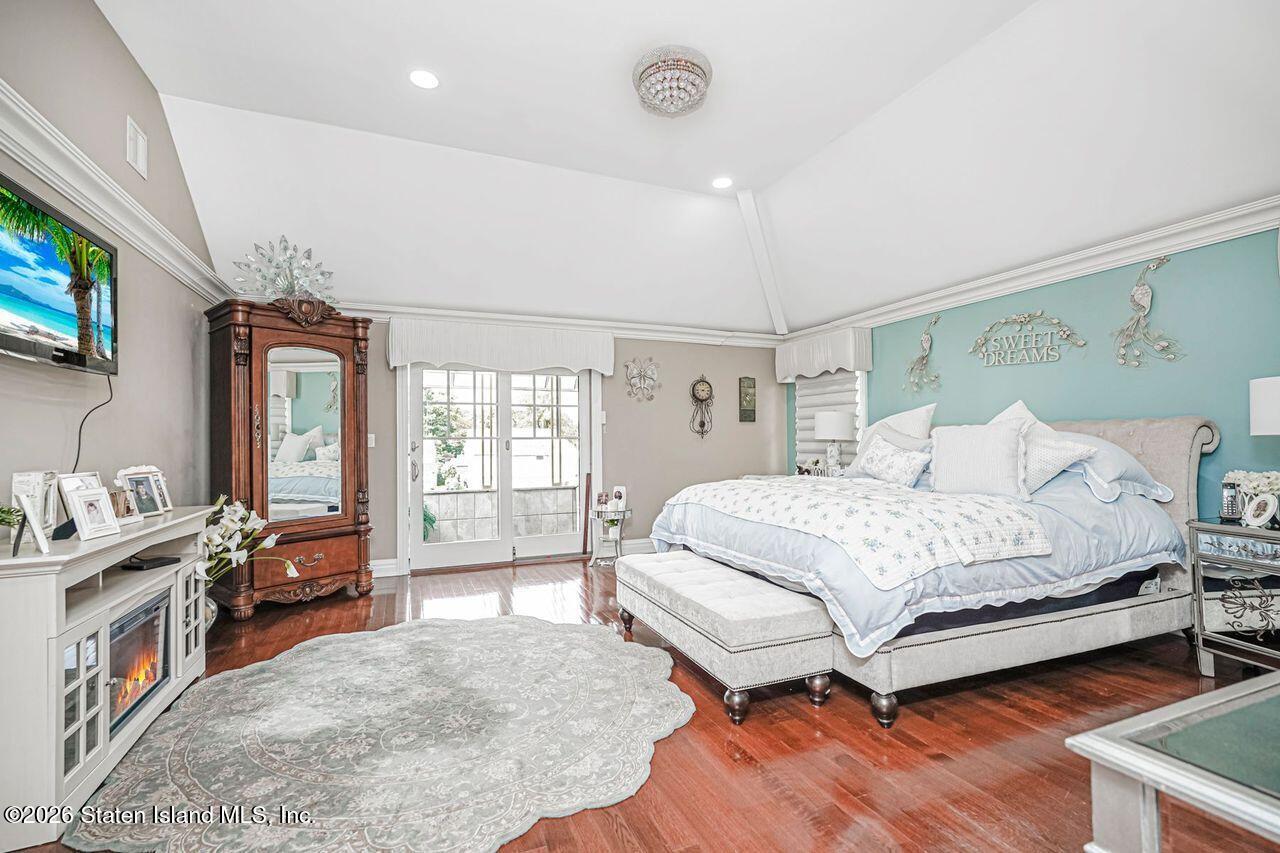 63 Finlay Avenue Staten Island, NY 10309 - Photo 26 of 44 a bedroom with a bed and a large window