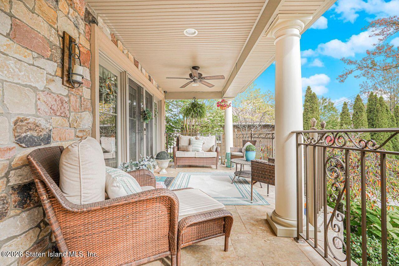 63 Finlay Avenue Staten Island, NY 10309 - Photo 3 of 44 a living room with furniture and a large window