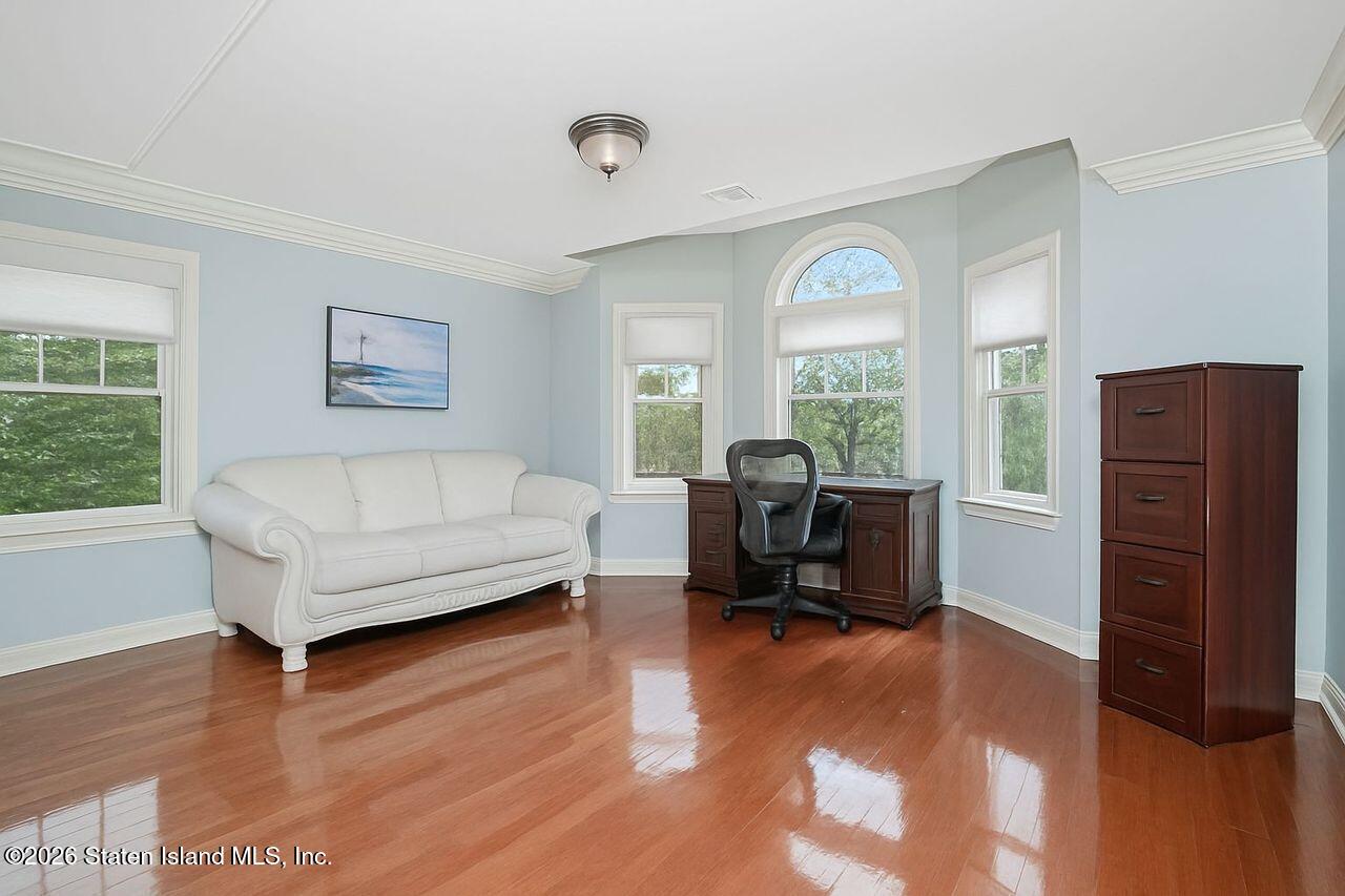 63 Finlay Avenue Staten Island, NY 10309 - Photo 33 of 44 a living room with furniture and a large window