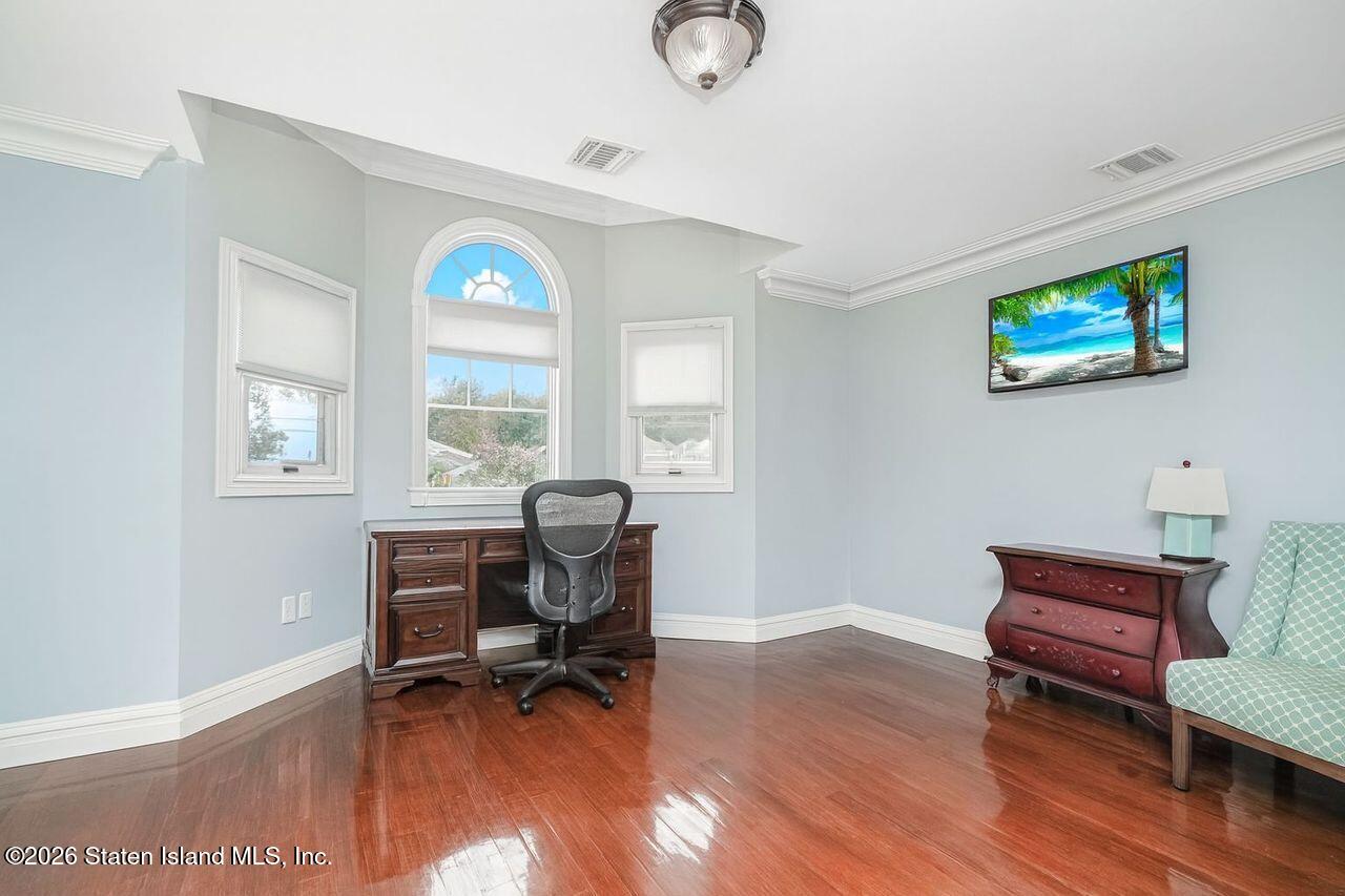 63 Finlay Avenue Staten Island, NY 10309 - Photo 34 of 44 a view of a workspace with furniture and a window