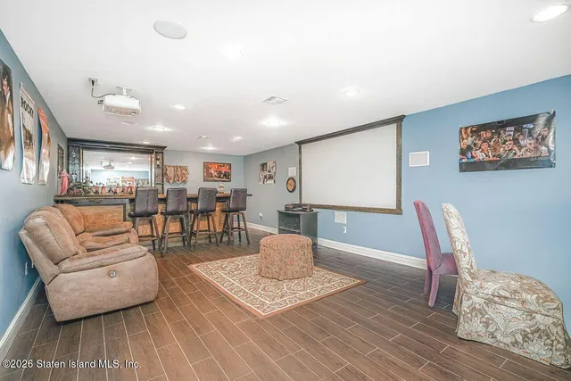 a view of an empty room with window and cabinet